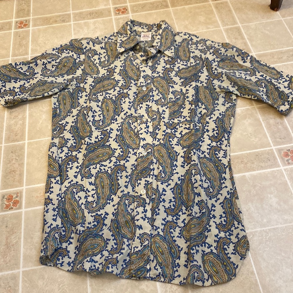 White shirt with blue designs and patterns